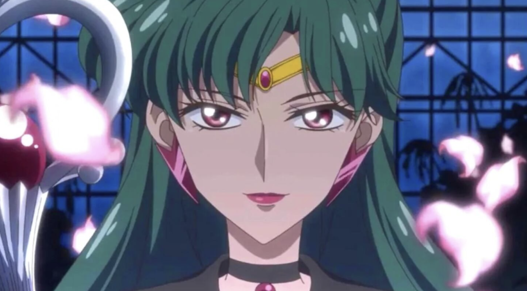 Personaje de anime con cabello verde y tiara dorada con gema roja.