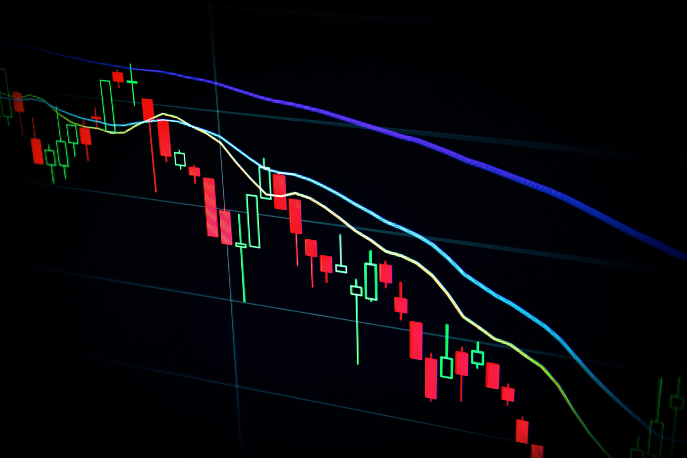 Gráfico de velas en descenso, representando una posible burbuja en el mercado de la inteligencia artificial